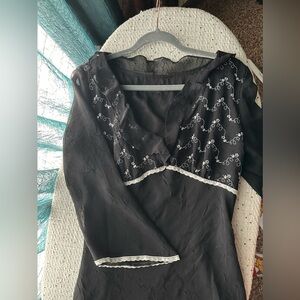 Black and white flowy lightweight dress! Asymmetrical bottom knee length size 12